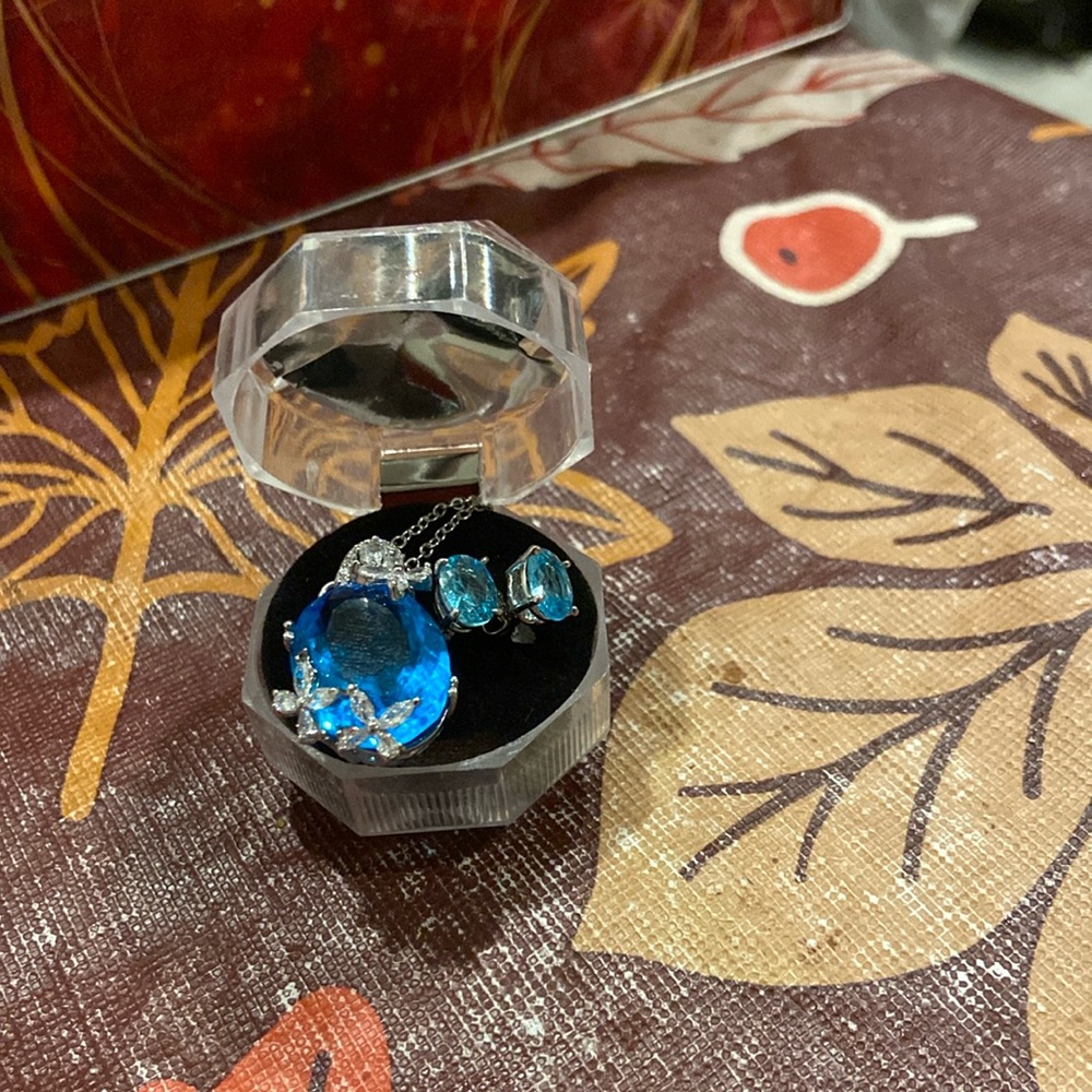 blue topaz butterfly pendant and blue oval sterling silver earrings